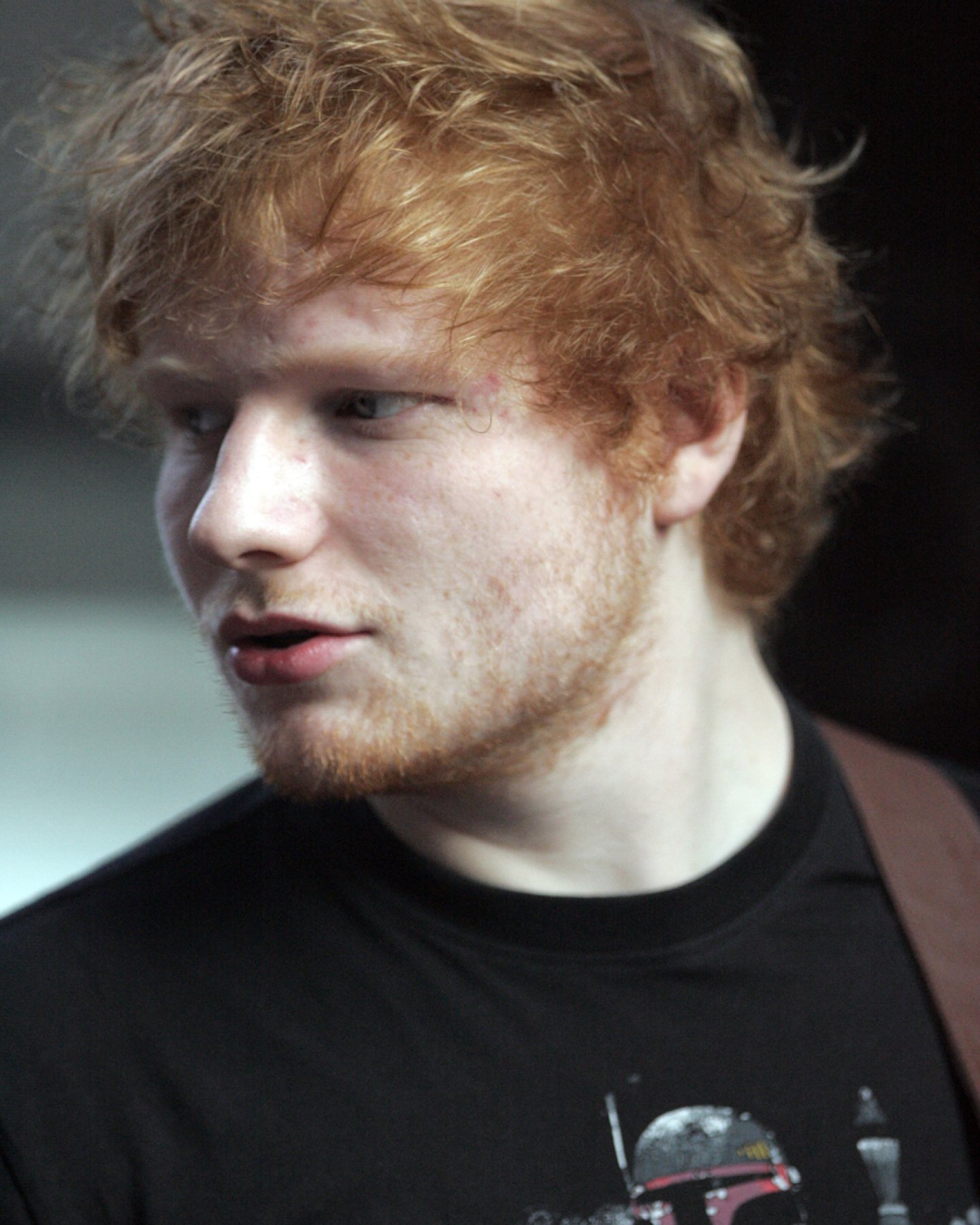 Ed Sheeran performing with a guitar