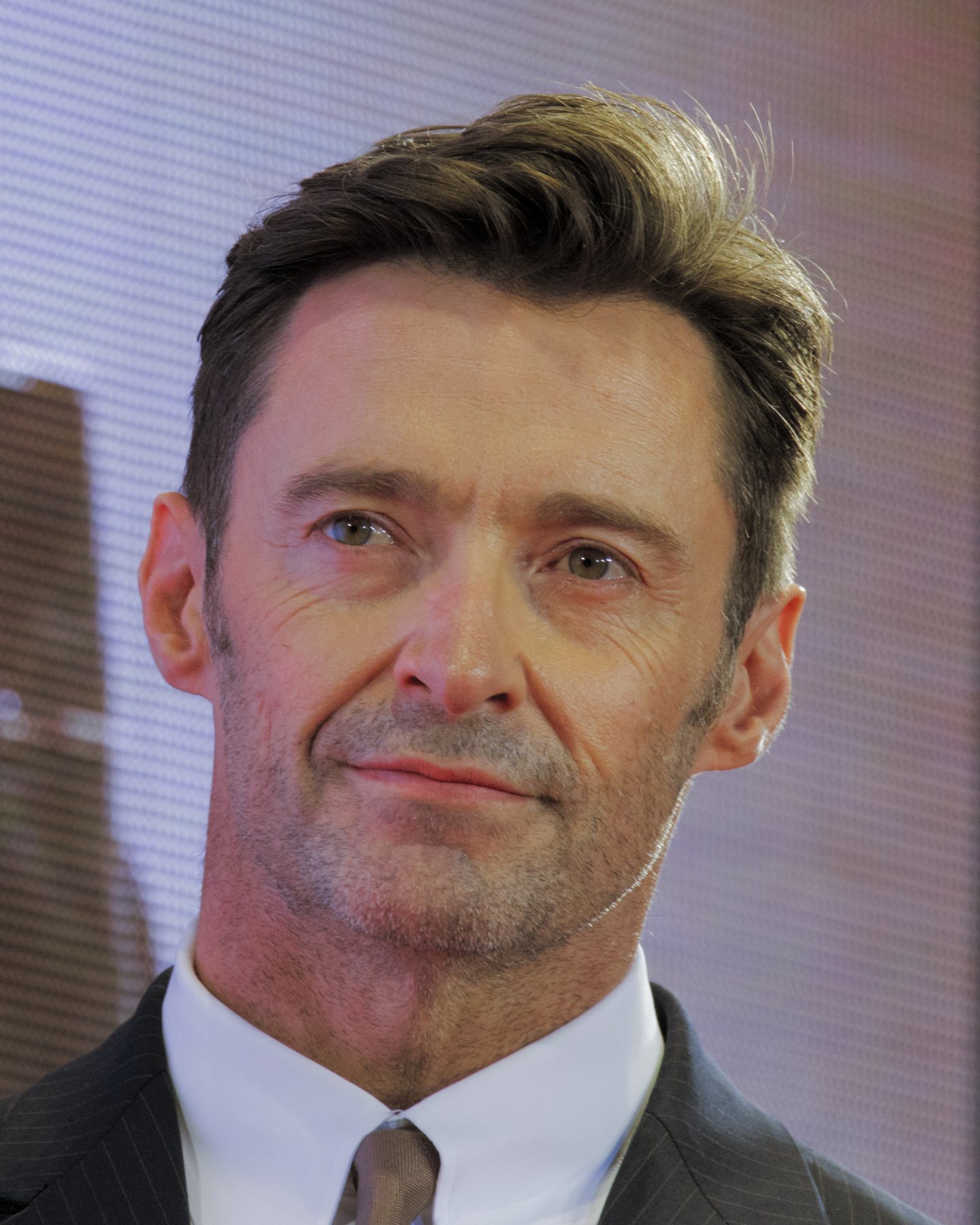 Hugh Jackman smiling at a public event